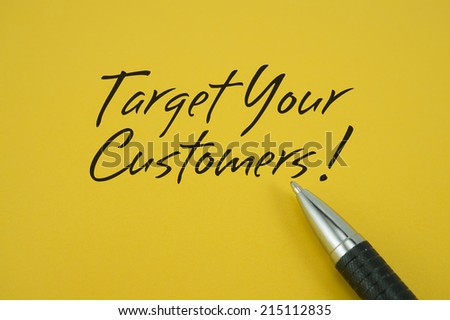 Target Your Customers! note with pen on yellow background