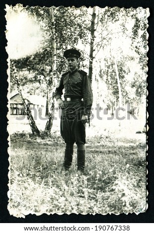 USSR - CIRCA 1953: Postcard shows soldiers on the background of birch trees, of the USSR, 1953
