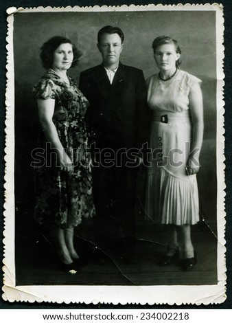 USSR - CIRCA 1960s: An antique photo show man and two women