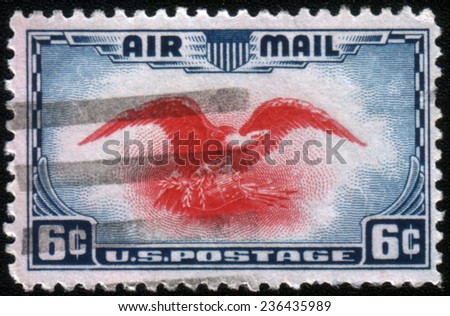 UNITED STATES - CIRCA 1930\'s : A stamp printed in United States. Eagle holding shield, olive branch and arrows. United States - CIRCA 1930\'s