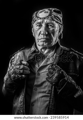 Portrait of an old man biker