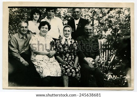 Ussr - CIRCA 1970s: An antique Black & White photo show family portrait in the garden
