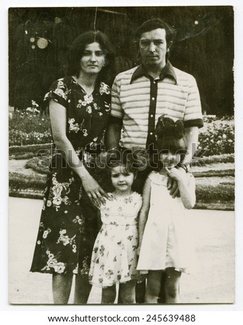Ussr - CIRCA 1980s: An antique Black & White photo show family for a walk in the park