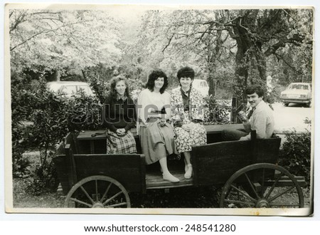 USSR - CIRCA 1970s: An antique Black & White photo show Three women and a man in a carriage