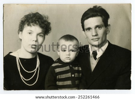 Ussr - CIRCA 1980s: An antique Black & White photo shows Family portrait of a young couple with a child, an old picture