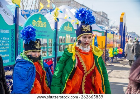 PETROPAVLOVSK, KAZAKHSTAN - MARCH 21, 2015: celebration of the new year on the solar calendar astronomical in Iranian and Turkic peoples. girls in national dress