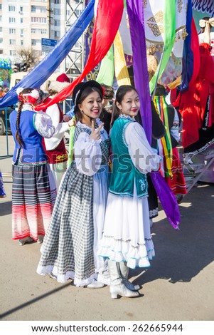 PETROPAVLOVSK, KAZAKHSTAN - MARCH 21, 2015: celebration of the new year on the solar calendar astronomical in Iranian and Turkic peoples. The girls in national dress