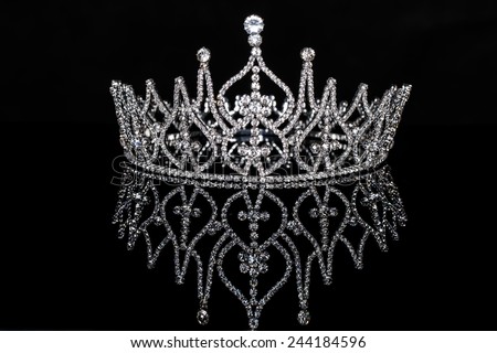 Beauty or Miss contest crown isolated on black with reflection.