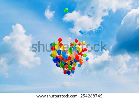 colourful, heart shaped balloons flying in the sky,