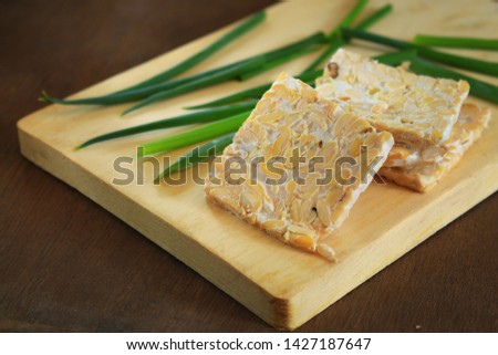 Fresh slices of tempe on the wooden background Photo stock © 