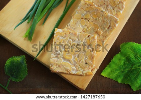 Fresh slices of tempe on the wooden background Photo stock © 