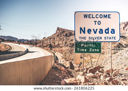 Welcome To Nevada. The Silver State. Highway Welcome Sign. Pacific Time Zone.