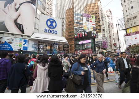 Hong Kong, China - December 30, 2010: People crossing a busy crosswalk in Causeway Bay, Hong Kong. Causeway Bay is a popular shopping area in Hong Kong.