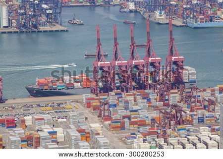 Hong Kong, China - Jun 15, 2015: Container ship unloading at the Kwai Tsing Container Terminals in Hong Kong