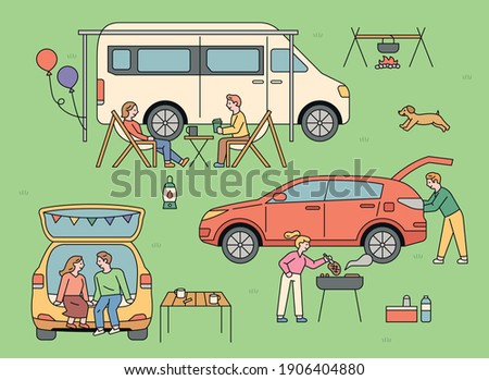 People who enjoy auto camping. Outdoors, people are camping in vans and cars. 