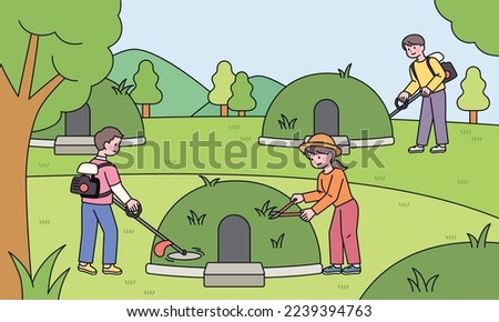 At the cemetery in nature, the bereaved family is trimming the grass on the grave.