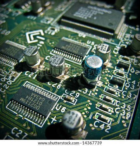Green electronic circuit close-up. Macro background