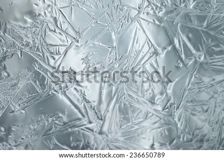 frost on the glass window abstract background is selective soft focus toned photo winter christmas