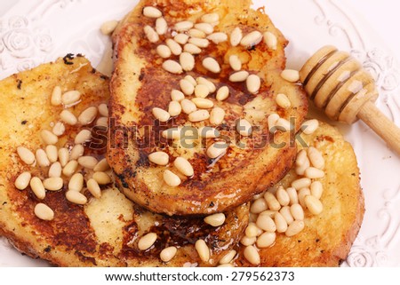 French toast with honey syrup croutons pine nuts breakfast sweet dessert selective soft focus
