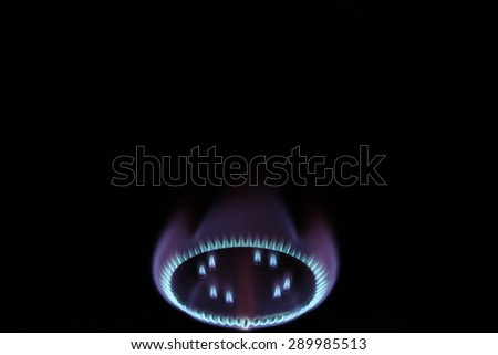 Burning gas burner flame in the dark mystic romance