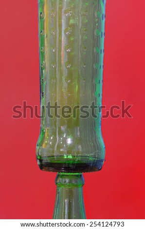 close up two overlap bottles on isolated red background