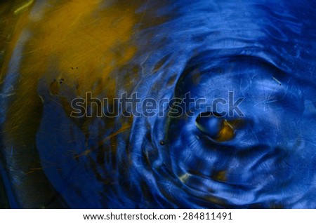 water drop with blue and orange reflect background