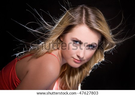 portrait of blonde girl  with flying hair