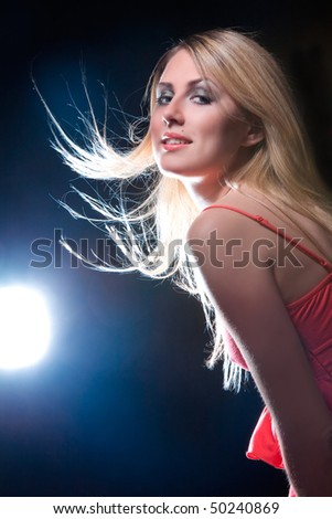 portrait of blonde girl with flying hair
