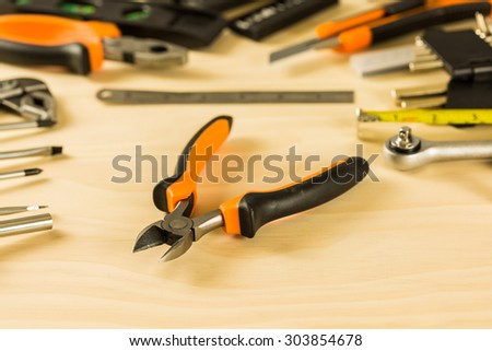 combination cutting pliers on wood table