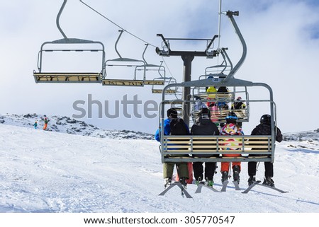 QUEENSTOWN, NEW ZEALAND - AUGUST 6: Unidentified skiers  ride the ski chair lift up the Remarkables Ski Area on August 6 2015 in Queenstown, South Island, New Zealand