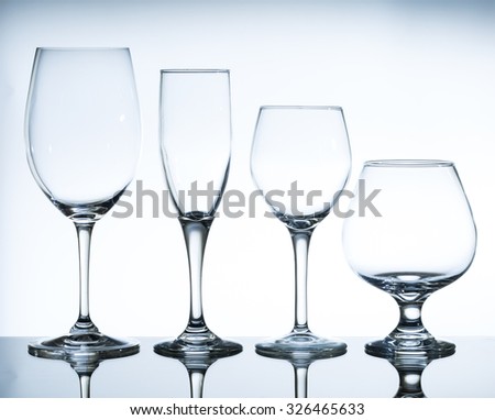empty wine glasses on the glass table and white background