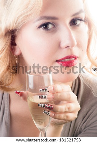 Beauty girl with sensual red lips long nails and glass of champagne isolated on white background