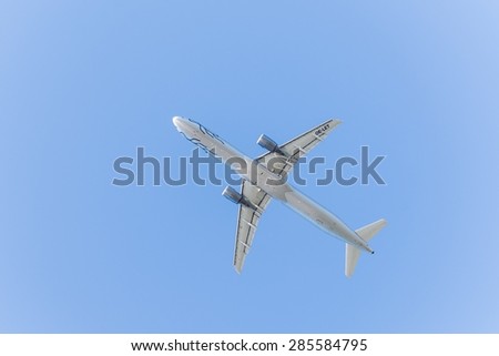 BERLIN, GERMANY July 06, 2015: An airplane photographed from the ground