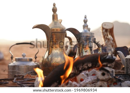 Traditional Arabic Coffee and Tea Pots at the Fireplace in the Desert in Riyadh, Saudi Arabia