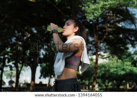 Similar – Image, Stock Photo Woman drinking isotonic drink while resting