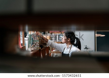 Similar – Image, Stock Photo Craftsman working with book and paper knife