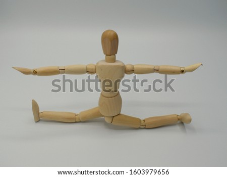 Similar – Image, Stock Photo wooden doll during yoga practice Ansanas, triangle Trikonasana, in front of white background