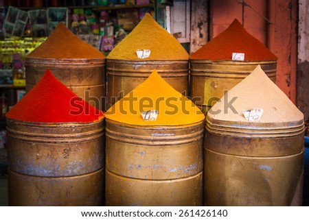 Colorful piles of powdered spices for sale in Marrakesh souq, Morocco. Shallow depth of field. Shallow depth of field.