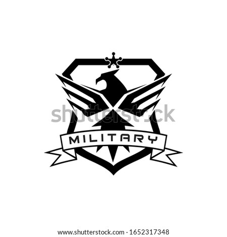 military flying  falcon eagle logo design in badge shield design template, emblem logo for military tactical armory security