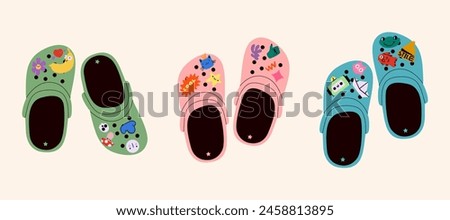 Set of crocs with embellishments. Unisex slates. Trendy vector illustration.