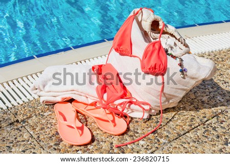 Concept of beach accessories near the pool