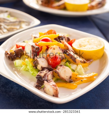 Italian cuisine. Octopus salad. Shallow DOF, square