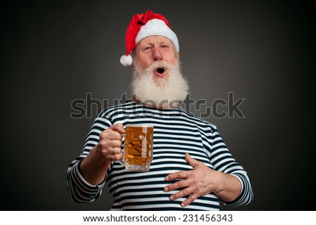 Handsome sailor isolated on black background. Seaman. Santa claus with beer