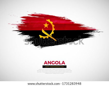 Grunge style brush painted Angola country flag illustration with Independence day typography. Artistic watercolor brush flag vector