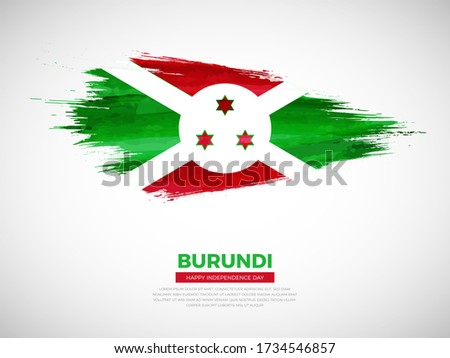 Grunge style brush painted Burundi country flag illustration with Independence day typography. Artistic watercolor brush flag vector