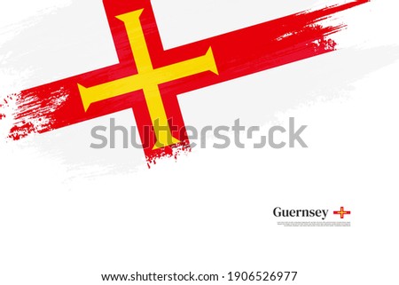 Stylish brush flag of Guernsey. Happy liberation day of Guernsey with grungy flag background