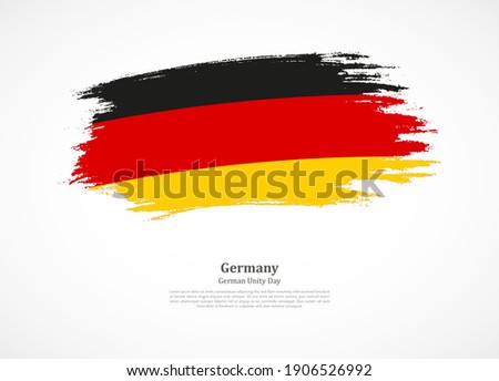 Happy german unity day of Germany with national flag on grunge texture