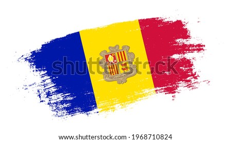 Flag of Andorra country on brush paint stroke trail view. Elegant texture of national country flag