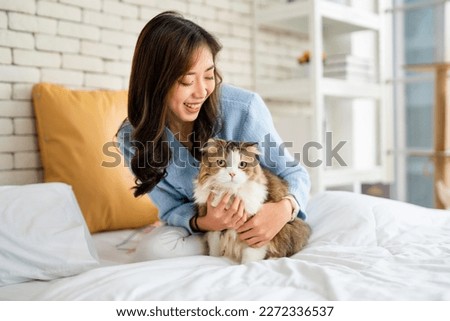 Similar – Image, Stock Photo Young woman hugging cat in hallway