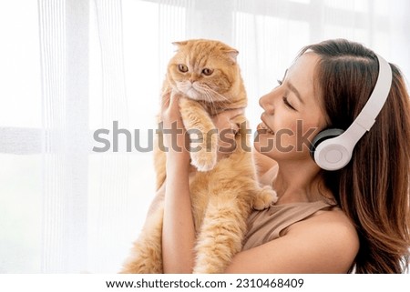 Similar – Image, Stock Photo Young woman hugging cat in hallway